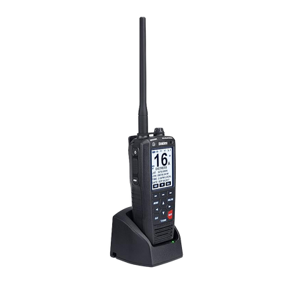 Left angled front view of Uniden MHS338BT handheld marine radio with screen on sitting on charger